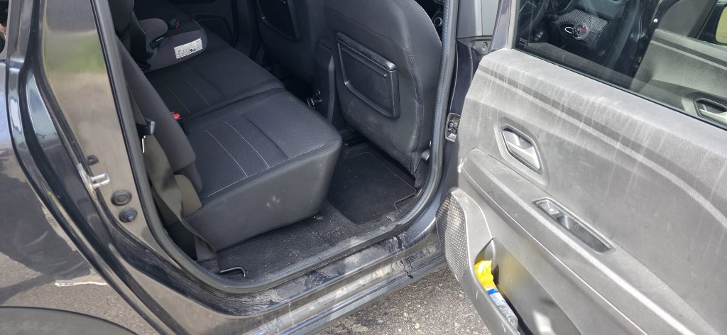 Dirty rear door card and sill before cleaning